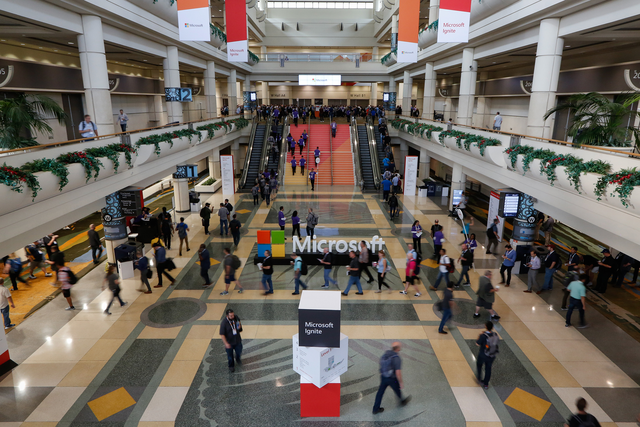 A crowd of people gather inside the venue for Microsoft Ignite