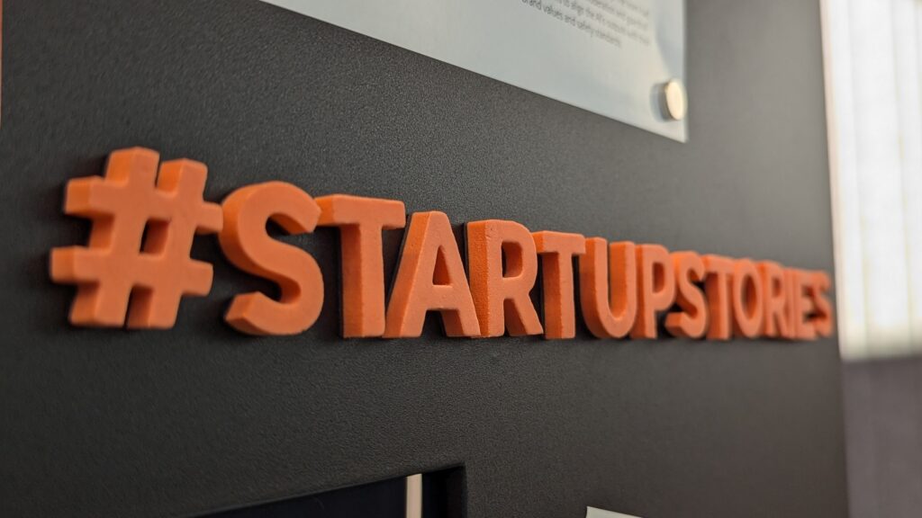 Magnets spelling out "#startup stories."