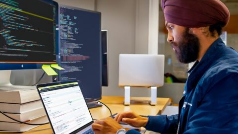 MAIDAP Blog – Differential Privacy (Part 1) Man sitting at a computer programming