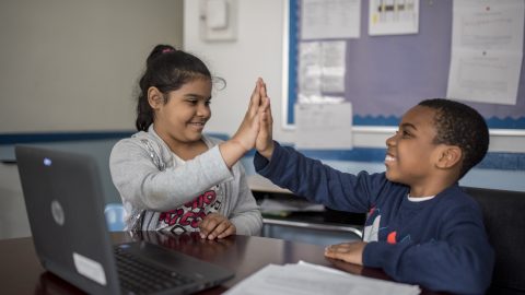 kids high fiving
