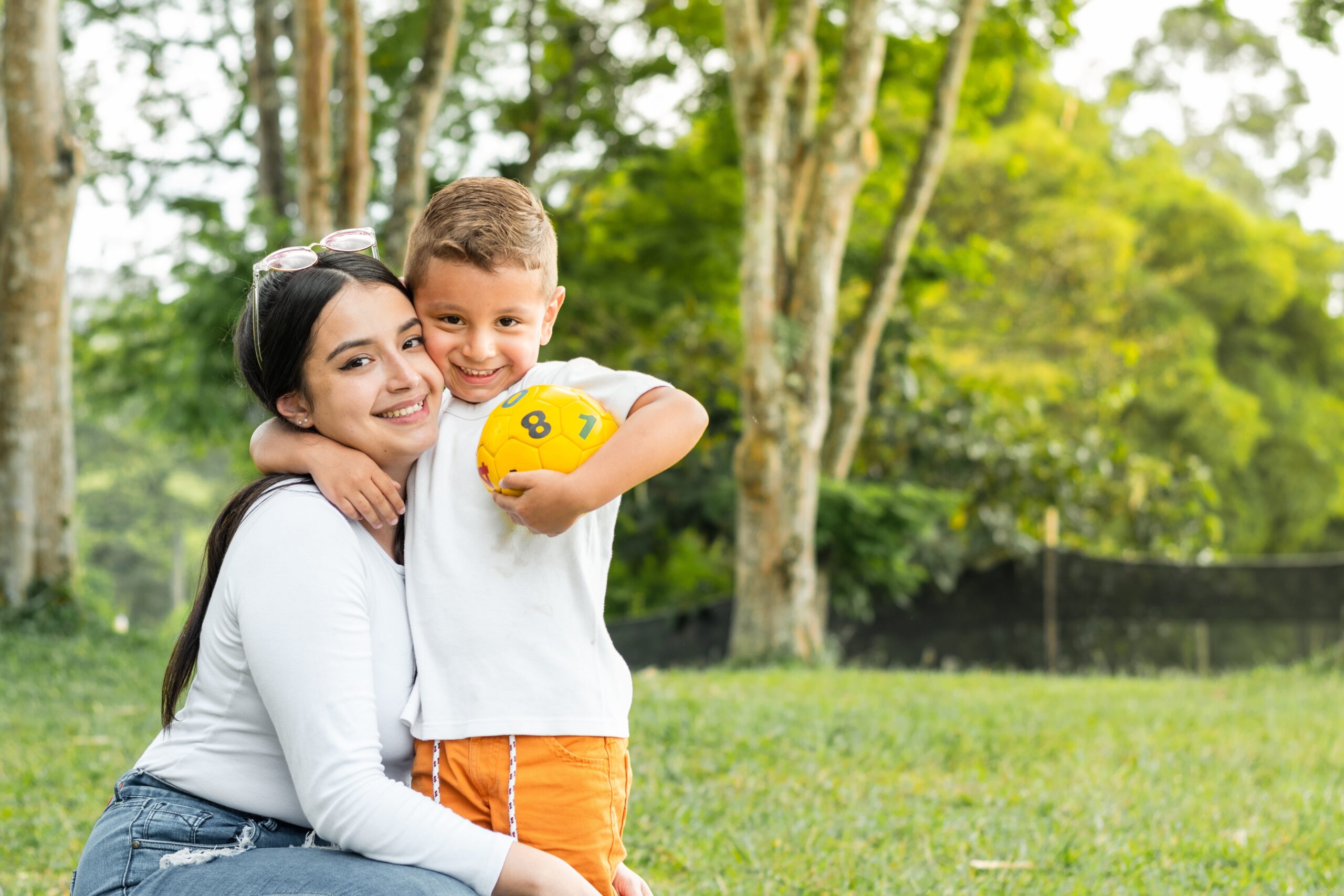 Mom and son playing in a park.