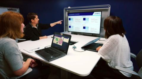 Employees from Jabil discussing AI solutions