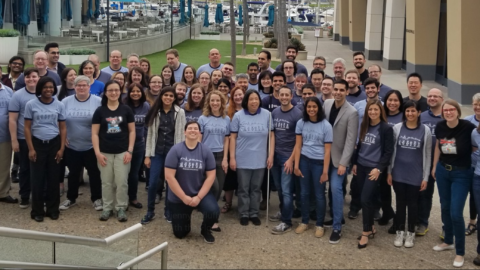 A group of people wearing blue Microsoft accessibility T-shirts at CSUN