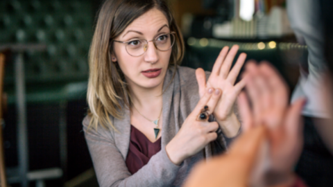 people communicating with sign language
