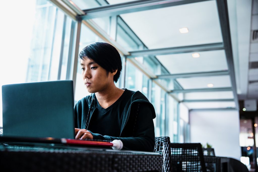 A tech worker with visual impairment uses assistive technology while visiting the Microsoft office in Singapore.