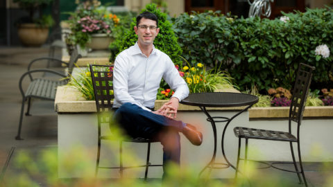 Microsoft general manager Mark Hammond, who developed a machine teaching platform, sitting at an outside table