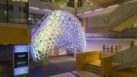 Ada's completed structure glowing at the bottom of building 99's atrium