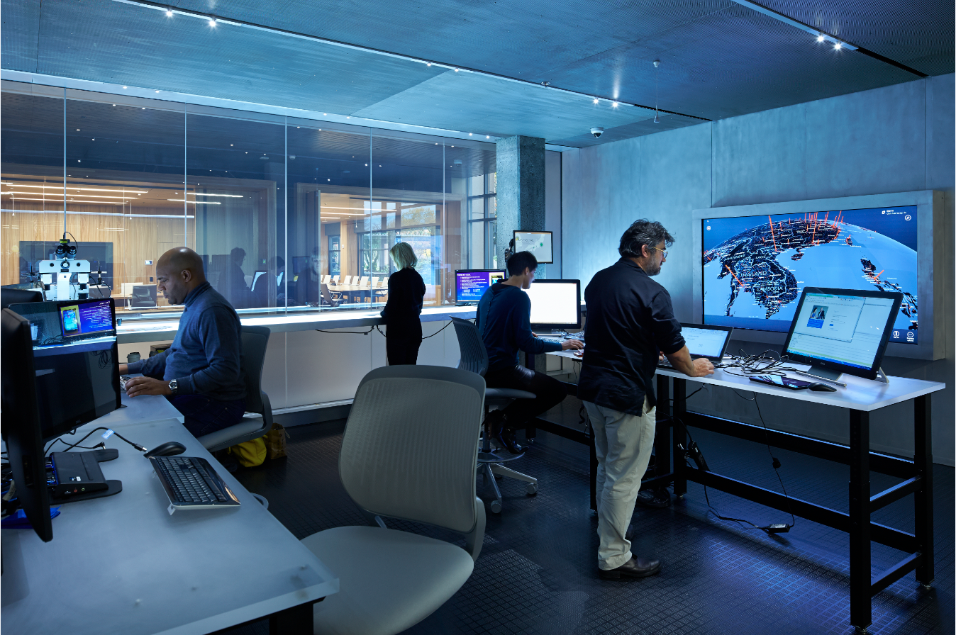 Members of the Microsoft Digital Crimes Unit work in a forensics lab in the Cybercrime Center.