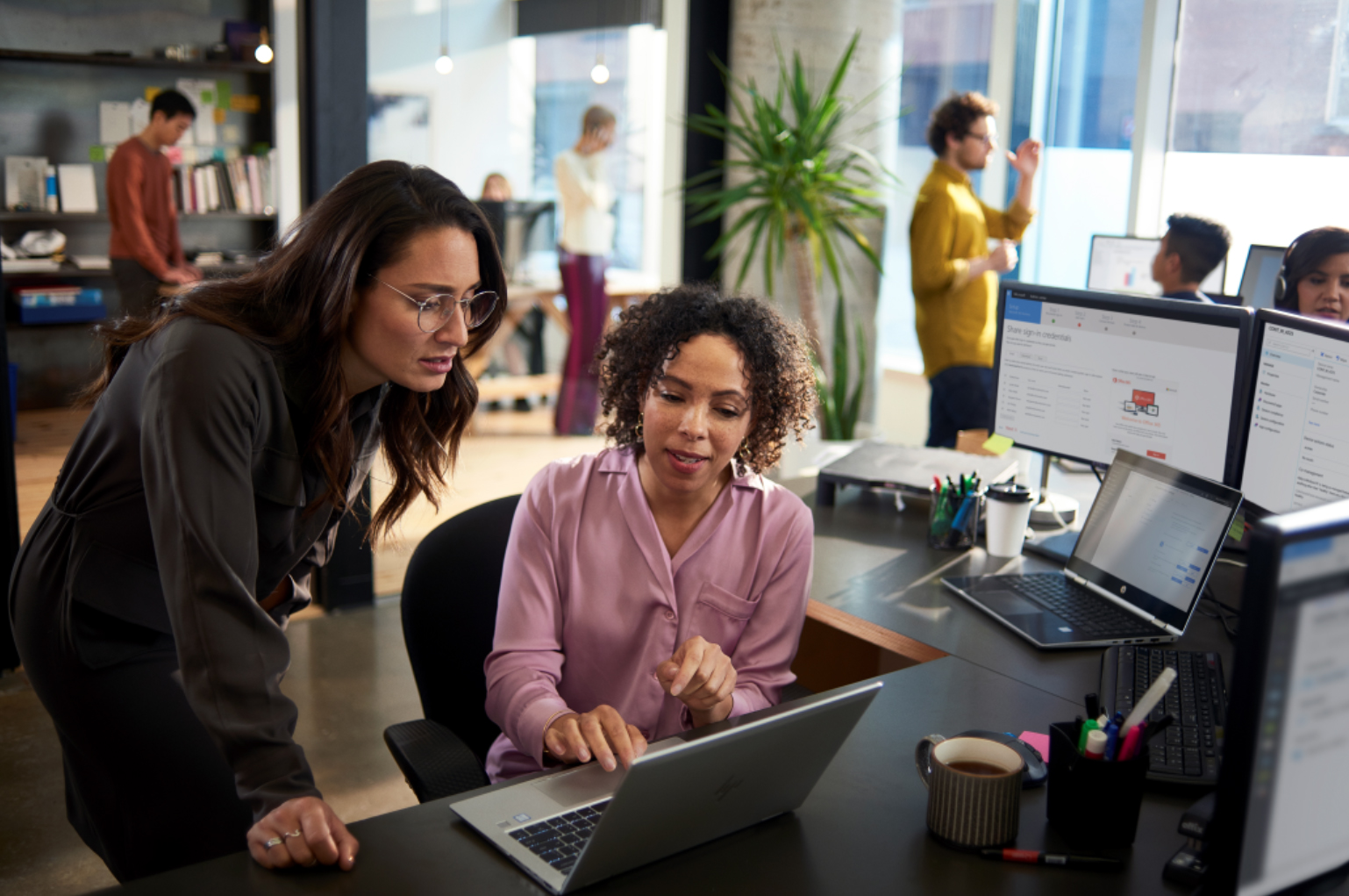 Two women in office with laptop