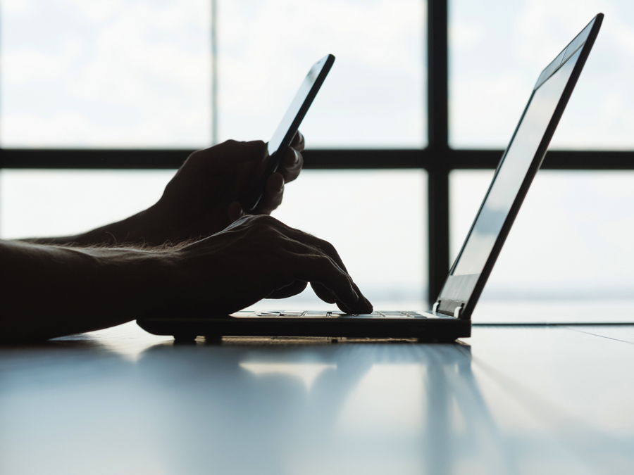 laptop and phone being used