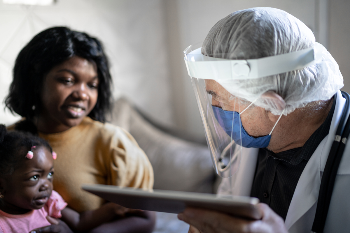 A doctor and patients with a tablet