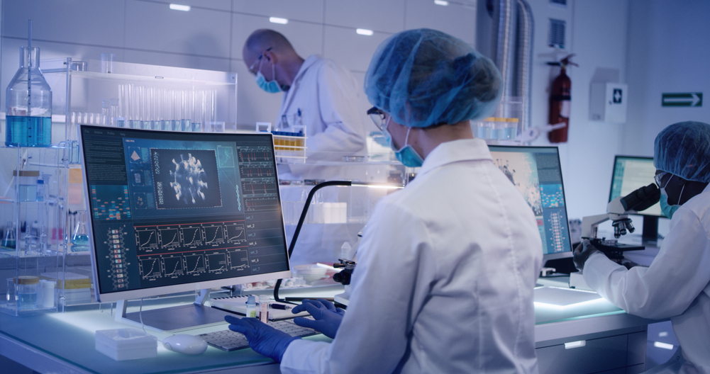 a woman in a lab on a computer
