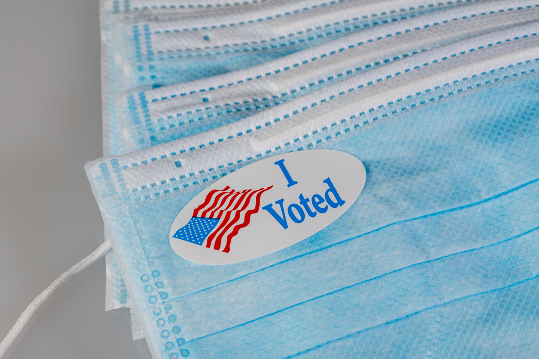An I Voted Sticker on a COVID mask