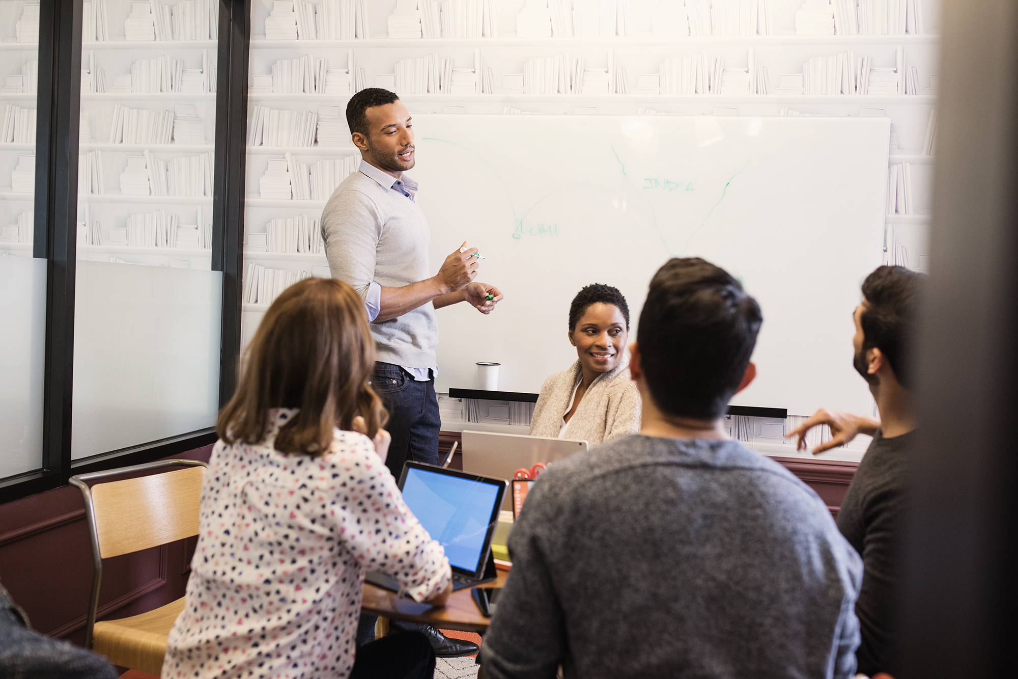 A group of people in a meeting
